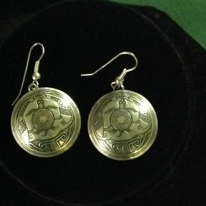Silver round earrings for pierced ears.
